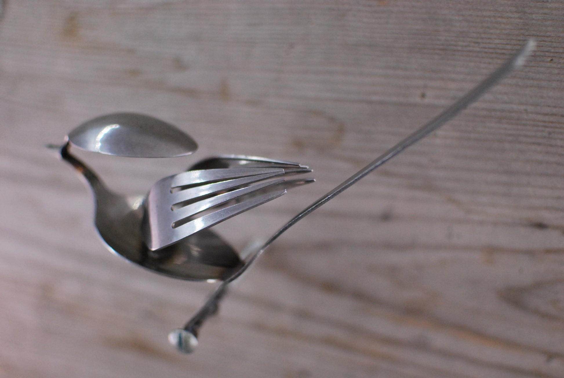 Recycled Silverware Bird Sculpture: Minimalist Metal Art
